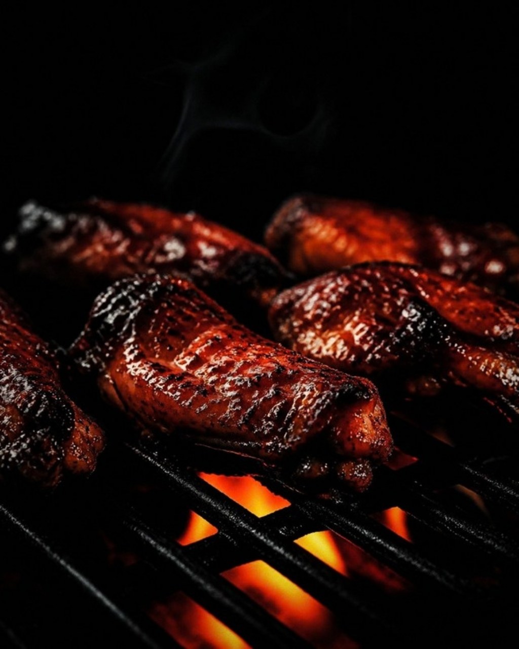 Glazed wings over open flame