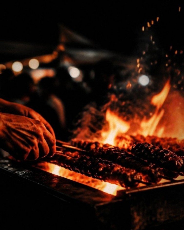 Skewers over open flame